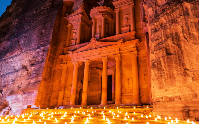 Al-Khazneh illuminated at night with candles, Petra, Jordan.