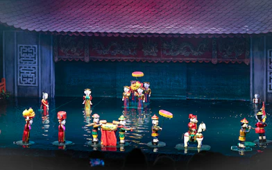 Water puppet performance in Ho Chi Minh City with colorful puppets on water stage.
