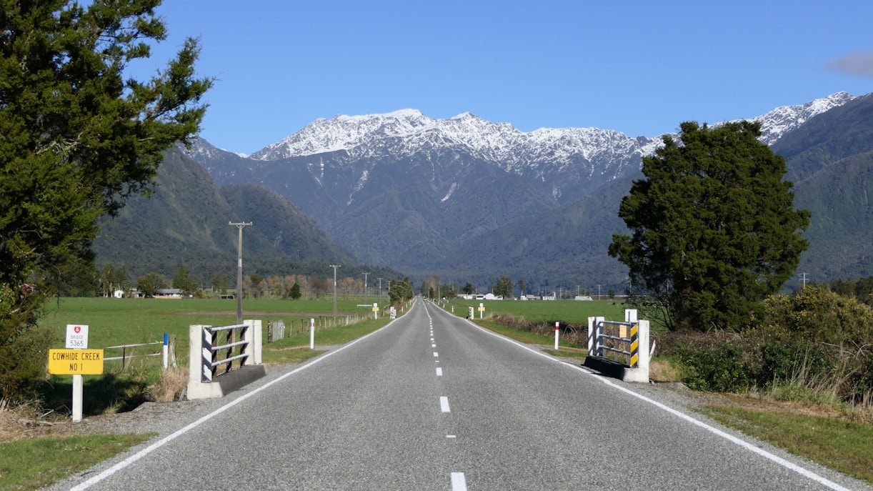 Highway SH6 leading to Mount Cook Mountain Range, New Zealand, near Franz Josef Glacier Village.