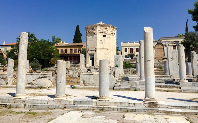 Tower of the Winds surrounded by ancient columns in Roman Agora, Athens.