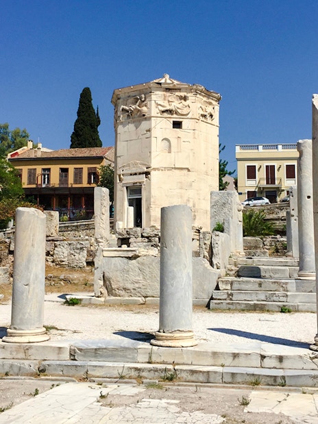 Tower of the Winds surrounded by ancient columns in Roman Agora, Athens.