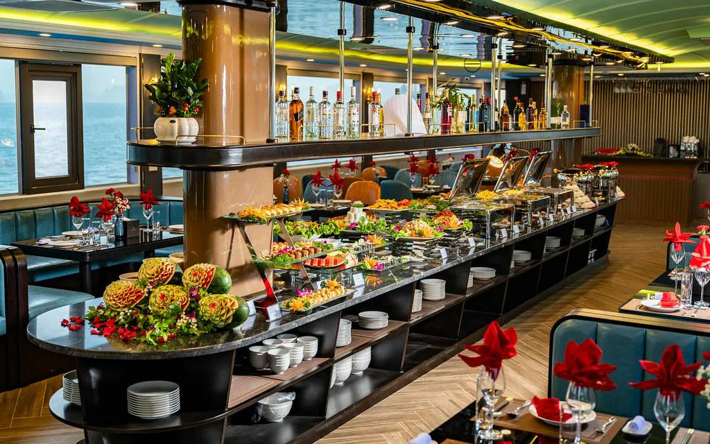 Luxurious buffet setup on La Casta Day Cruise, Ha Long Bay, featuring gourmet dishes and elegant decor.