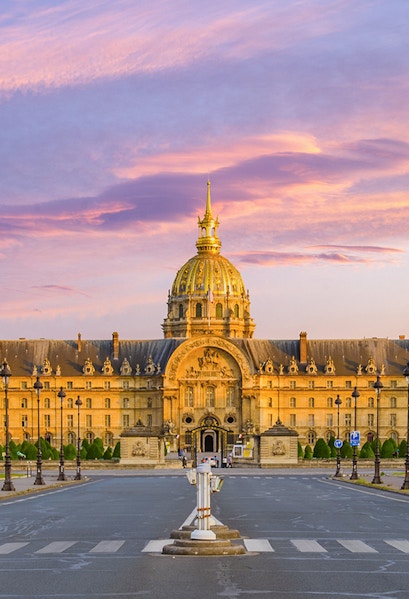 Army Museum in Paris with golden dome at sunset.