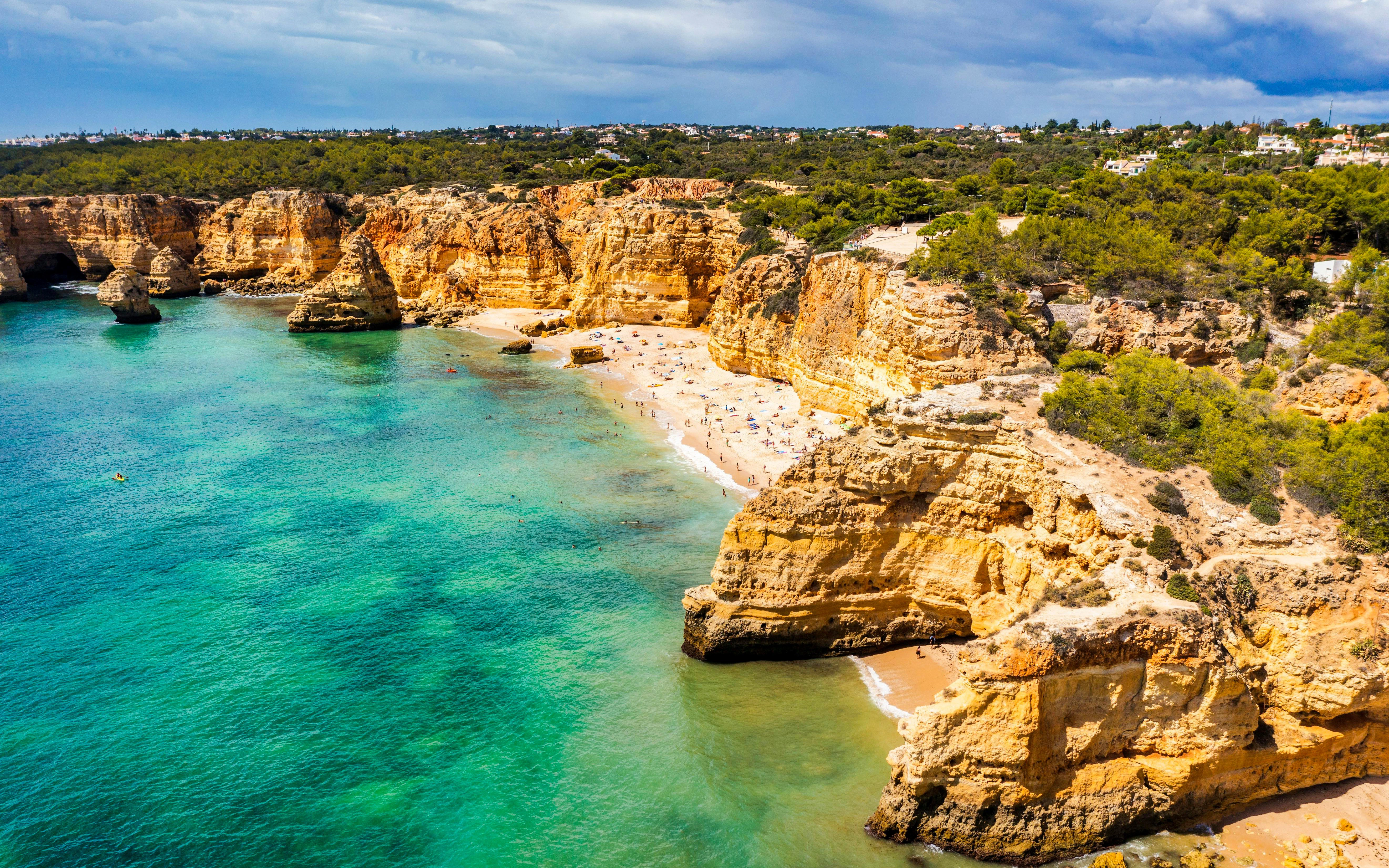 Praia da Marinha beach with cliffs and seagulls, Algarve, Portugal.
