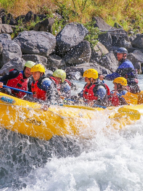 Group river rafting on a rapid in Interlaken, Switzerland.