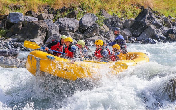 Group river rafting on a rapid in Interlaken, Switzerland.