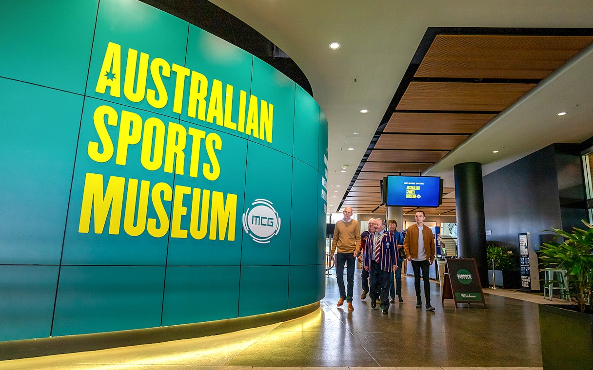 Australian Sports Museum entrance with visitors on MCG tour.