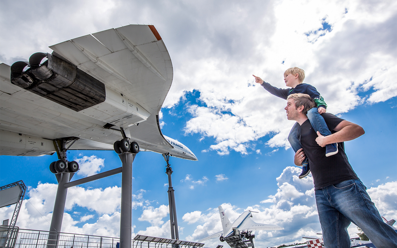 Visitors observing Tupolev aircraft at Technik Museum Sinsheim, Germany.