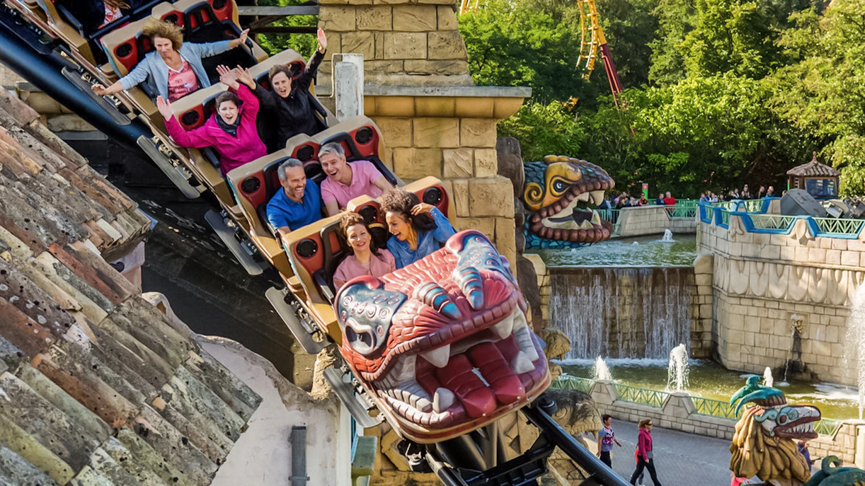 Tourists on Huracan ride at Bellewaerde Park, Belgium, enjoying thrilling loops.
