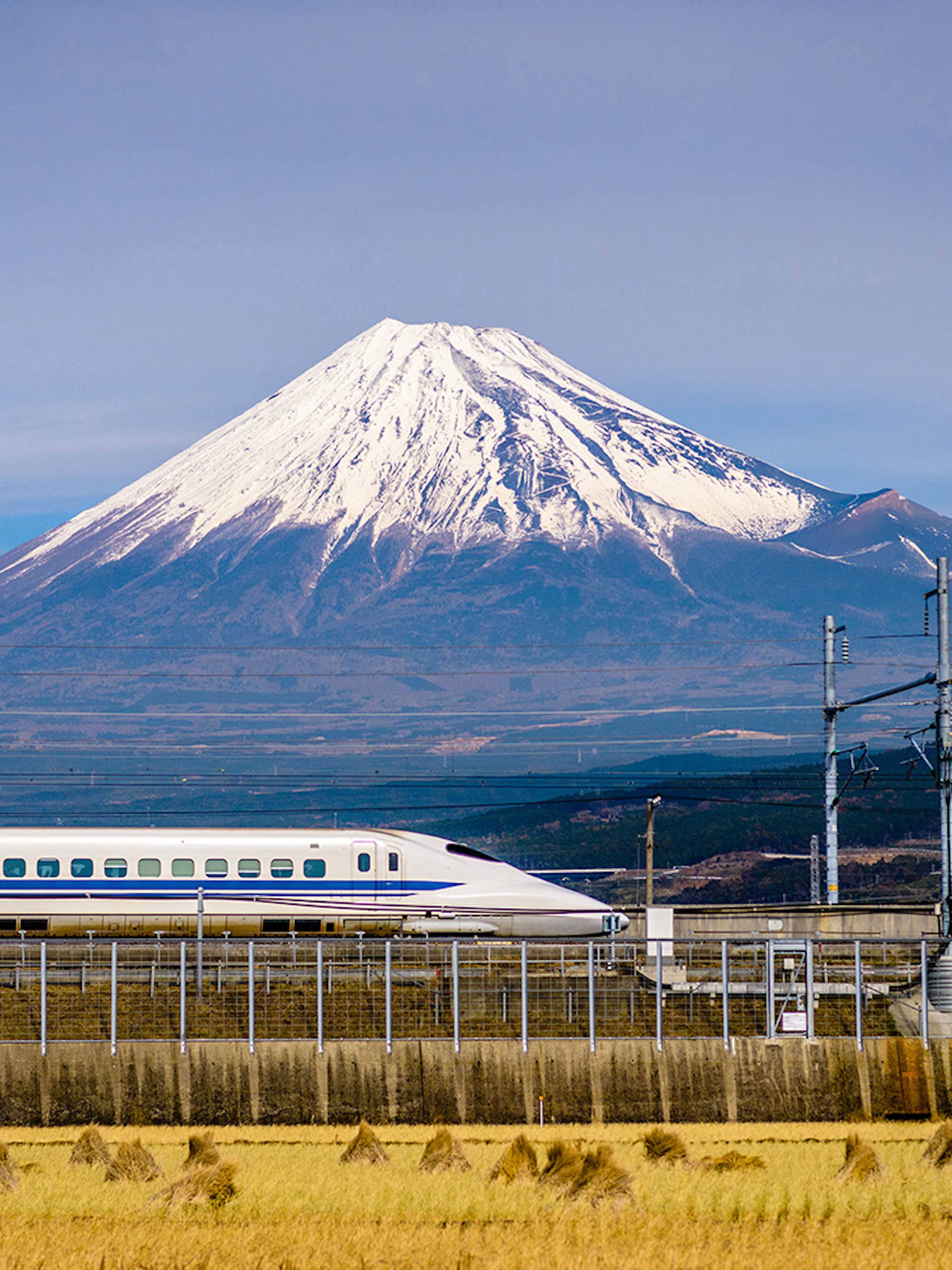 High-speed train passing in front of Mt. Fuji, Japan.
