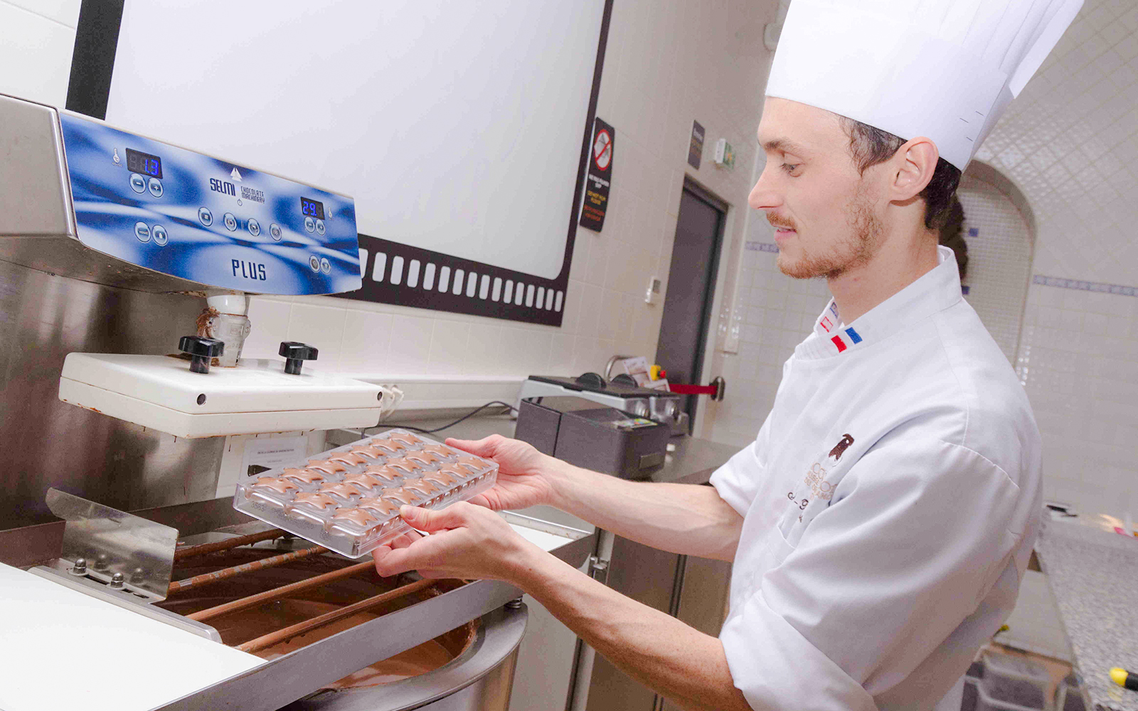 Chocolate chef preparing molds at Choco-Story Paris.