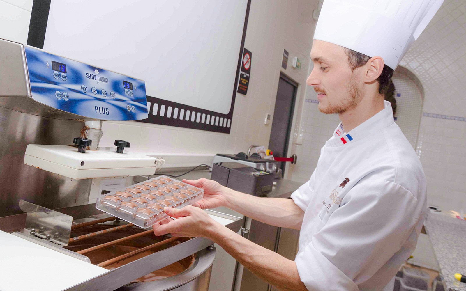 Chocolate chef demonstrating techniques at Choco-Story Paris.