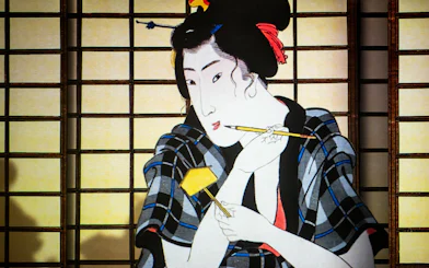 Japanese art depicting a woman with a brush, featured in Rotterdam: Remastered – Spirit of Japan.