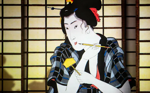 Japanese art depicting a woman with a brush, featured in Rotterdam: Remastered – Spirit of Japan.