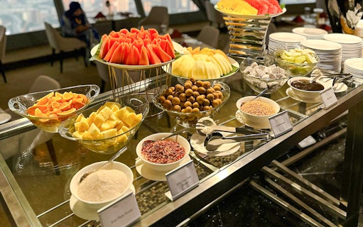 Buffet spread with fruits and condiments at ORBIT Revolving, KL Tower.