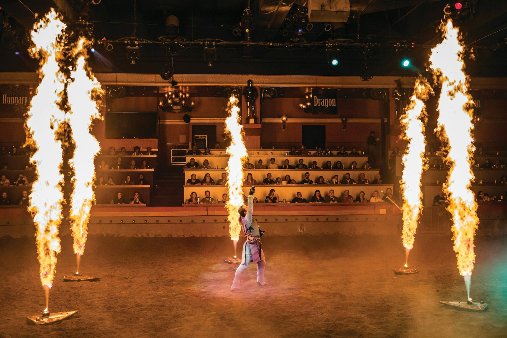 Performer with fire effects at Tournament of Kings show in Las Vegas arena.