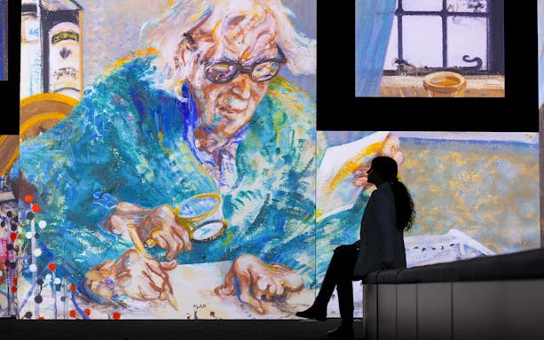 Frameless National Portrait Gallery exhibit featuring a large colorful painting of an elderly person writing.