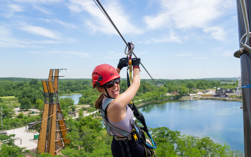 Ziplining over a scenic lake in Chicago with a city pass.