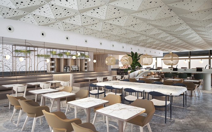 Lounge seating area at Istanbul Ataturk Airport with modern decor and dining tables.