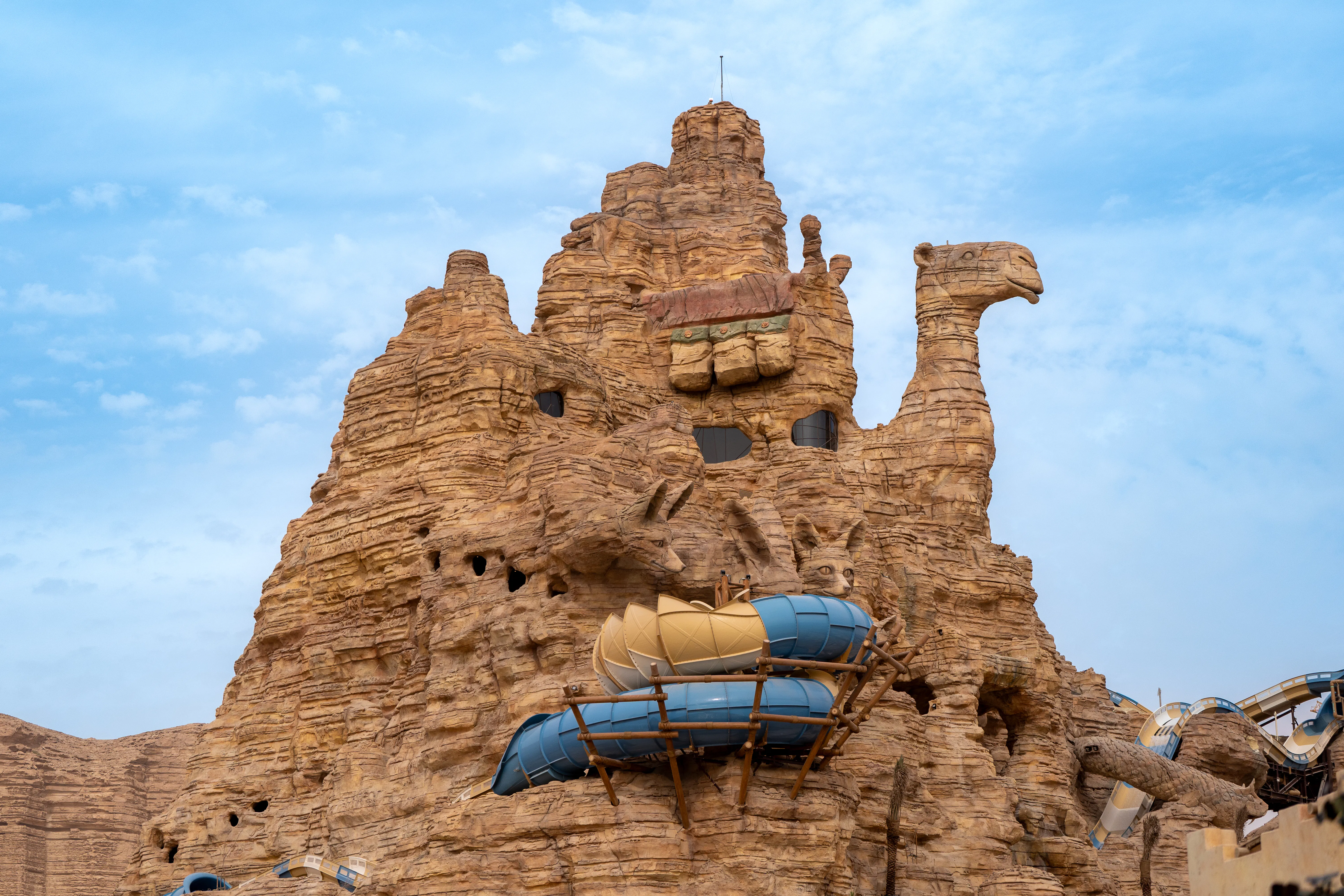 Camel-shaped rock formation with water slides at Aquarabia Water Theme Park, Qiddiya City, Saudi Arabia.