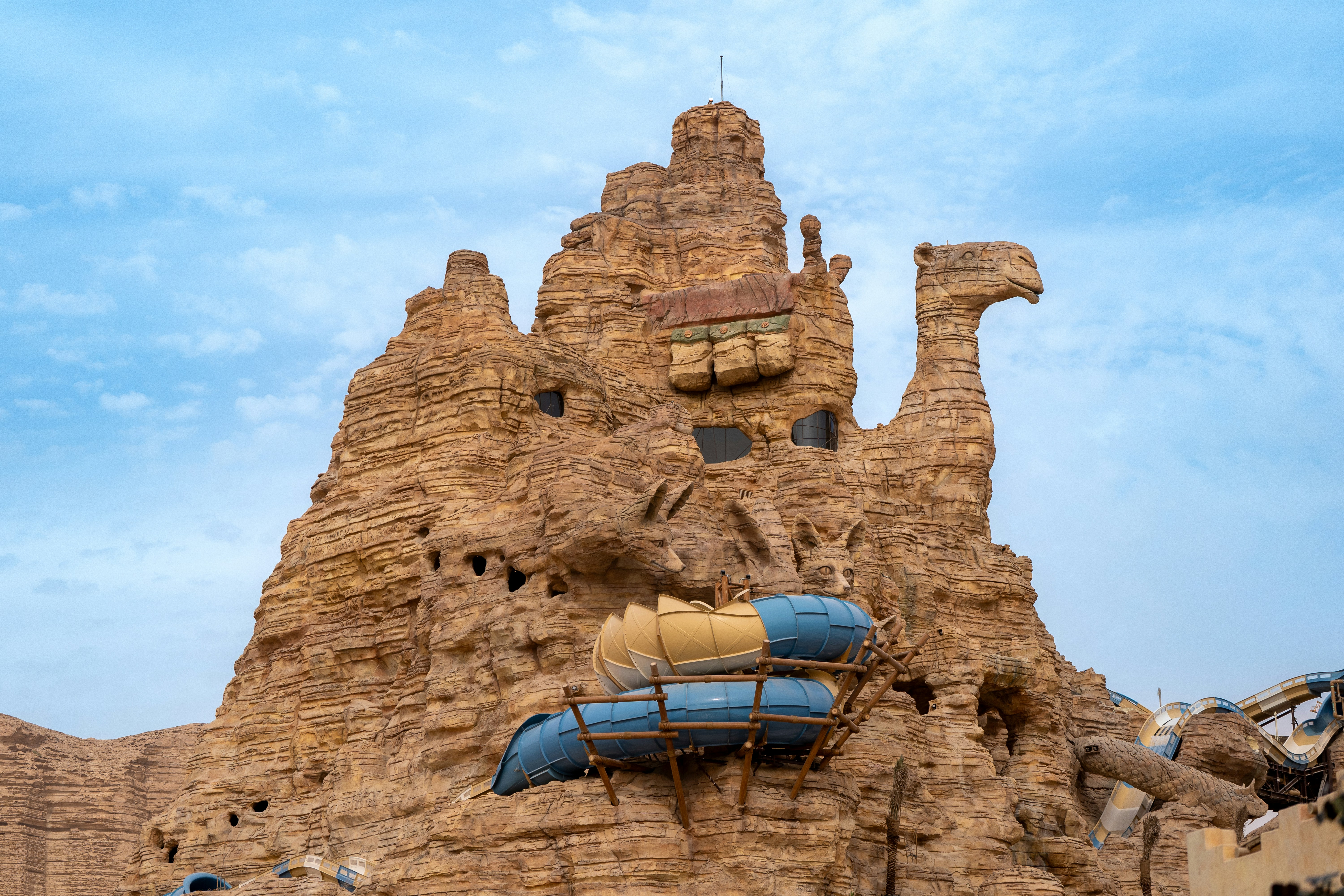 Camel-shaped rock formation with water slides at Aquarabia Water Theme Park, Qiddiya City, Saudi Arabia.