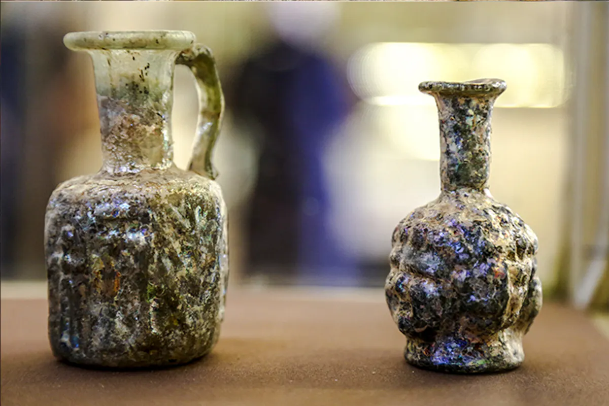 Ancient glass artifacts displayed in Amman Citadel museum.