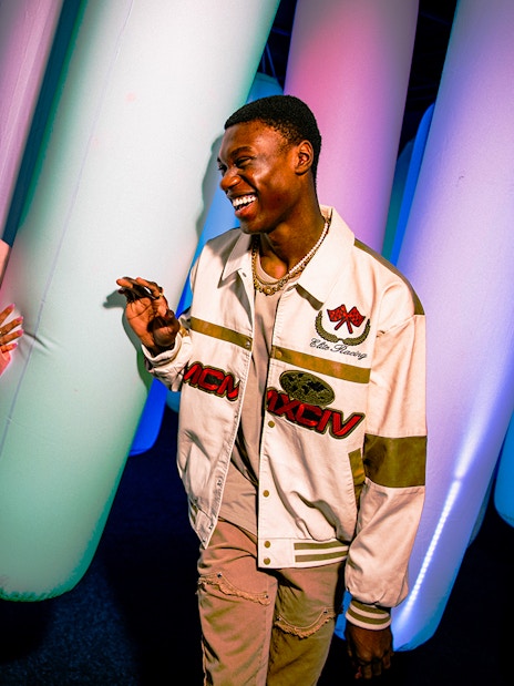 Visitors enjoying colorful inflatable pillars at WONDR Experience.