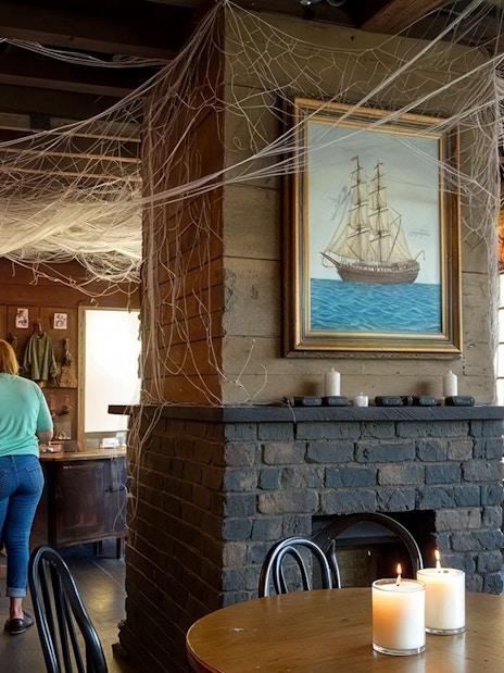 Inside Lafitte’s Blacksmith Shop, patrons at bar, New Orleans haunted pub crawl.