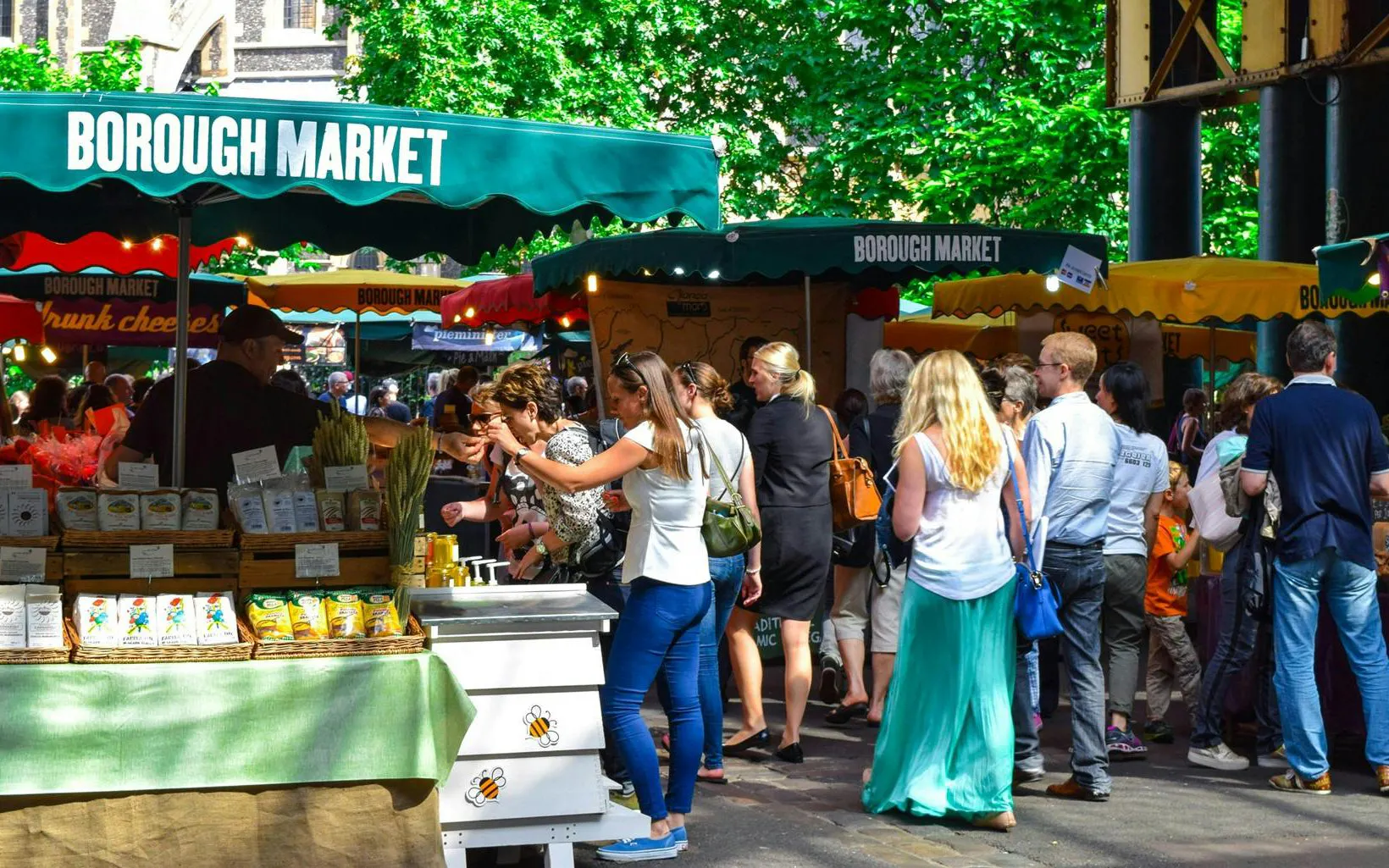 Crowd exploring stalls at Borough Market, South Bank, London.
