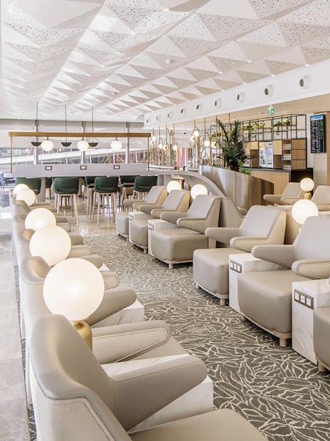 Istanbul Ataturk Airport lounge with seating and modern decor.
