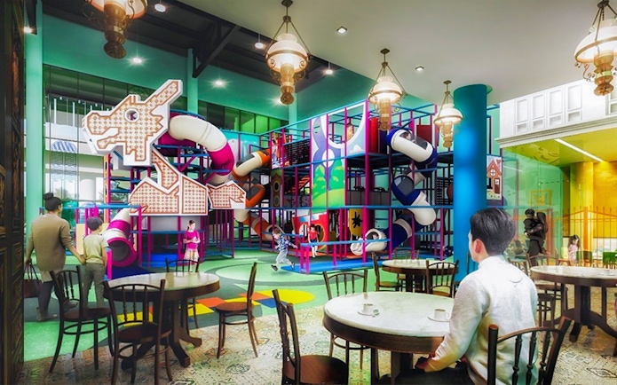 Indoor playground with colorful slides and climbing structures at T-Play Khatib.