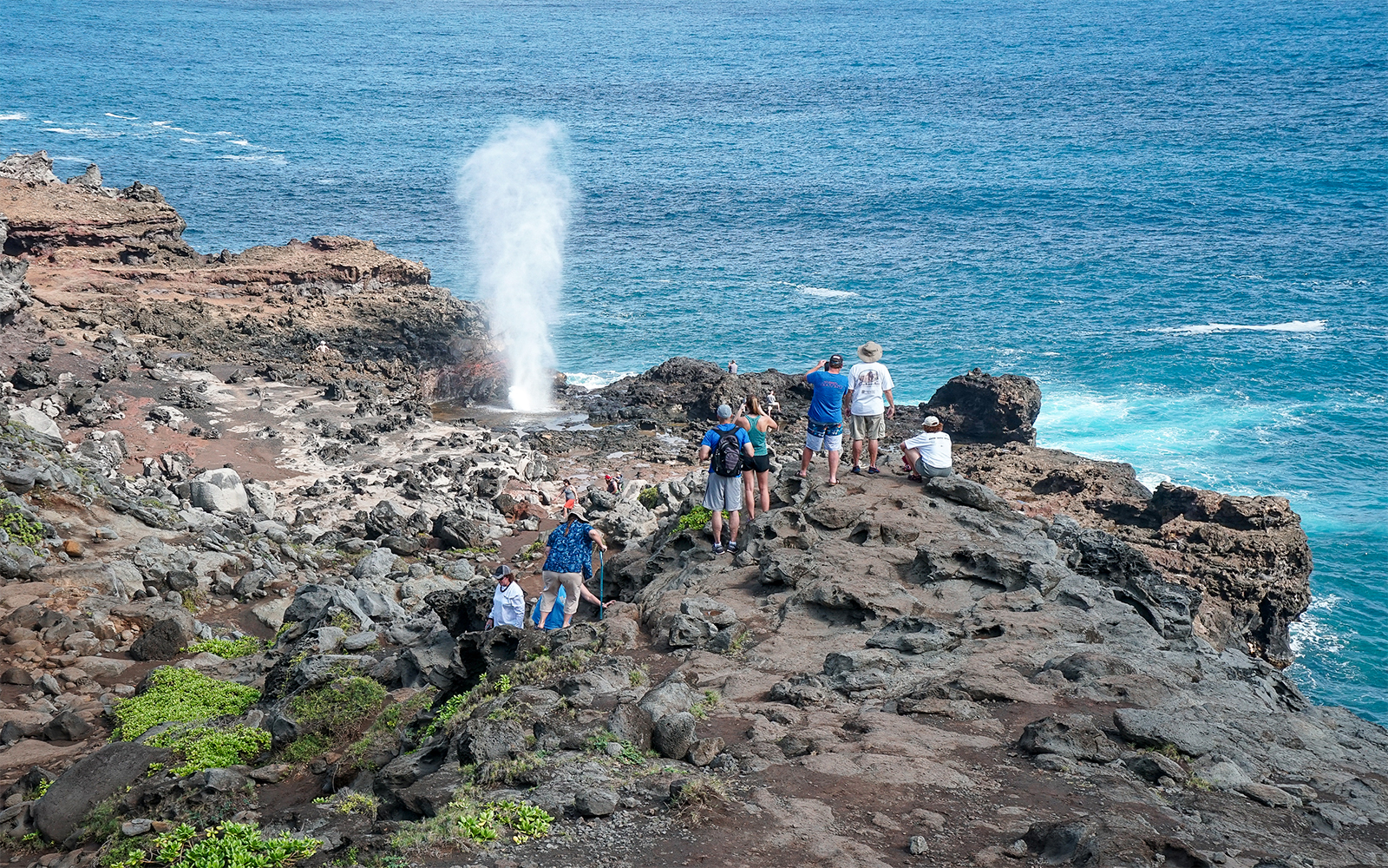 Tourists at Nakalele Blowhole in Hawaii