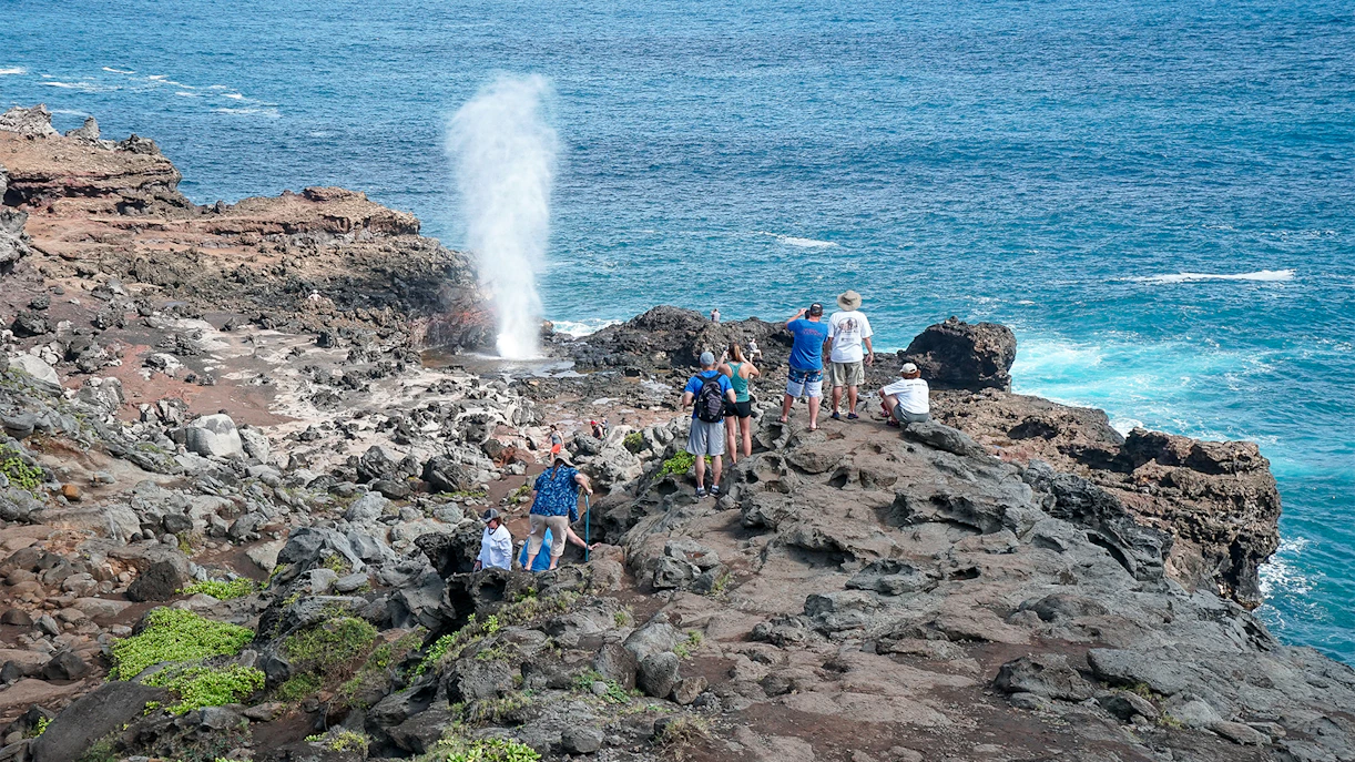 Tourists at Nakalele Blowhole in Hawaii