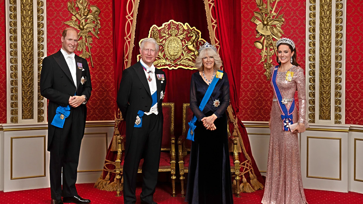 Wax figures of British royals in regal attire at Madame Tussauds London.