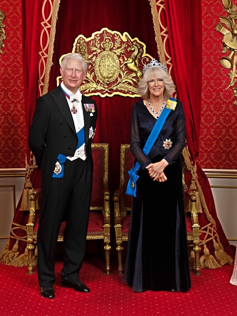 Wax figures of British royals in regal attire at Madame Tussauds London.