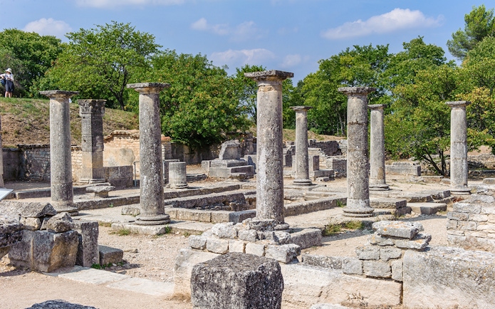 Ancient stone columns at Glanum Archaeological Site in Saint-Rémy-de-Provence, France.