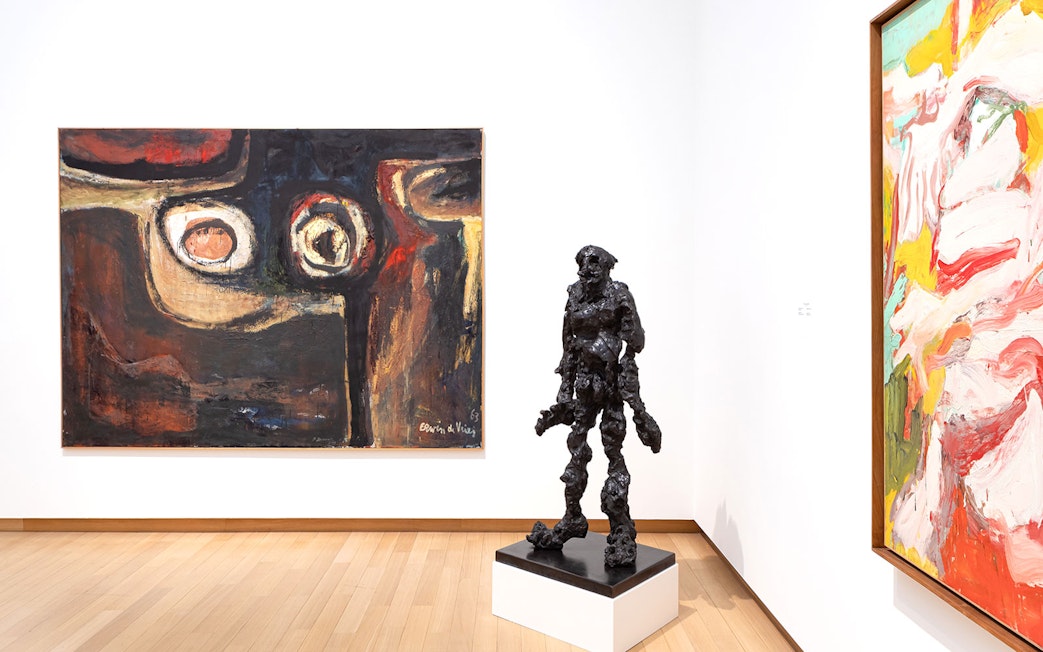 Installation view of abstract paintings and sculpture at Stedelijk Museum exhibition.
