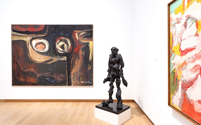 Installation view of abstract paintings and sculpture at Stedelijk Museum exhibition.