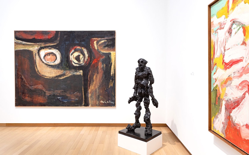 Installation view of abstract paintings and sculpture at Stedelijk Museum exhibition.