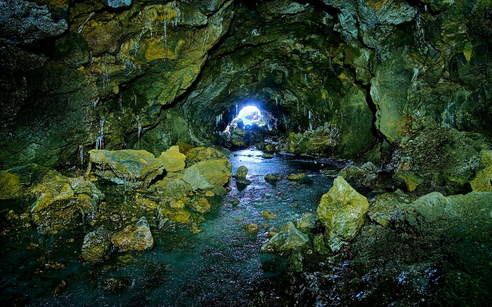 Mount Etna Caves tour showcasing volcanic rock formations in Sicily, Italy.