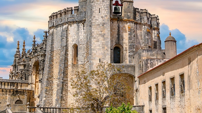 Convent of Christ in Tomar, Portugal, featuring the round Templar church and bell tower.