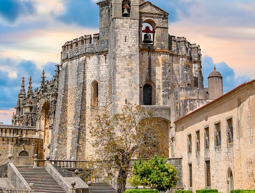Convent of Christ in Tomar, Portugal, featuring the round Templar church and bell tower.