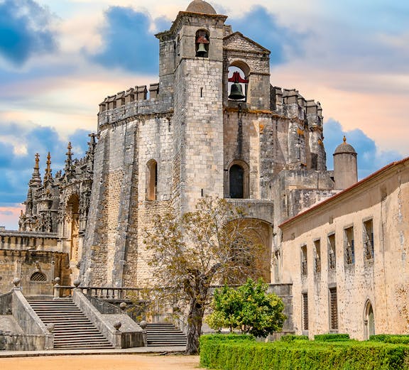 Convent of Christ in Tomar, Portugal, featuring the round Templar church and bell tower.