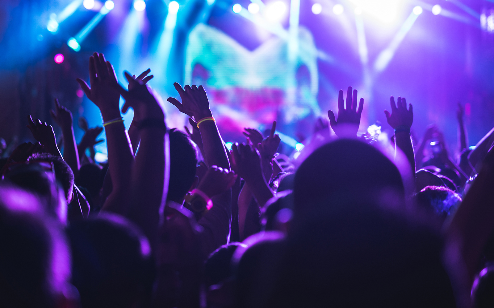 Silhoutte of people dancing in a Night club