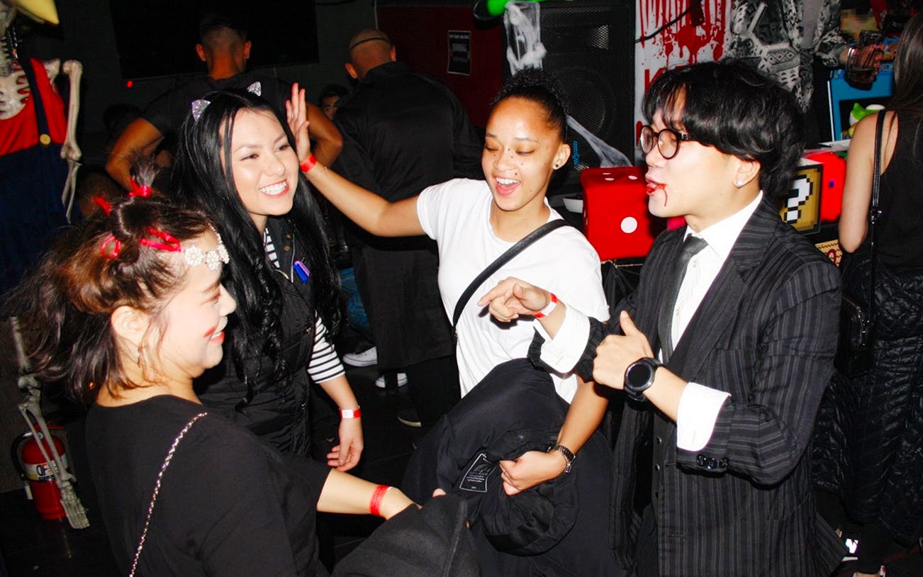Group enjoying a lively night out during the Busan Pub Crawl.