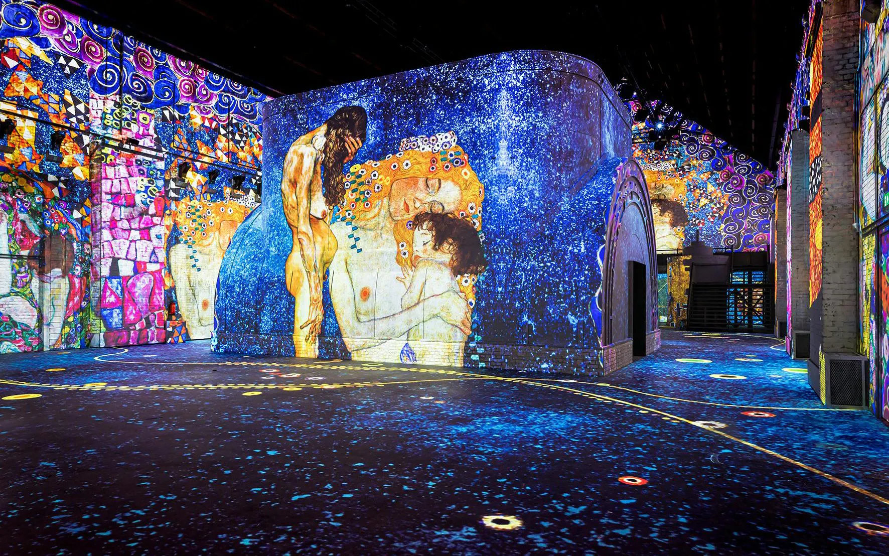 Immersive art projections at Fabrique des Lumières, featuring vibrant colors and patterns.