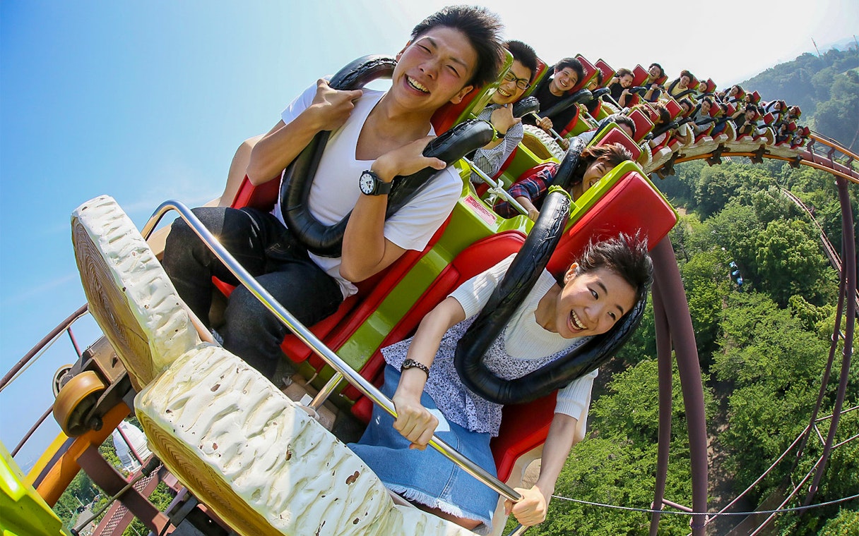 Riders enjoying a rollercoaster at Yomiuriland, Japan.