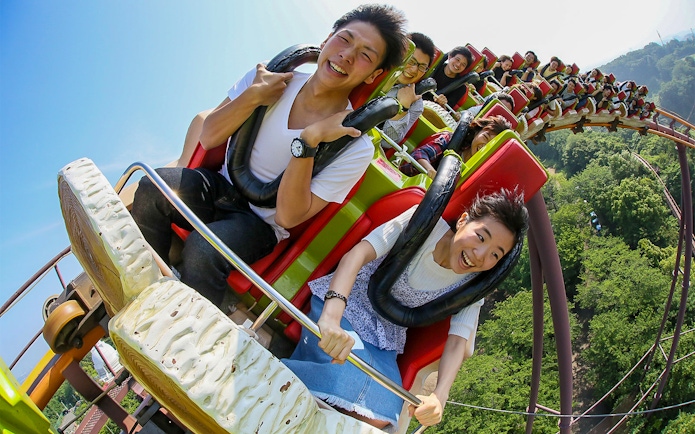 Riders enjoying a rollercoaster at Yomiuriland, Japan.