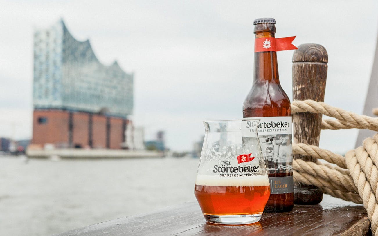 Störtebeker beer with Elbphilharmonie in Hamburg background.