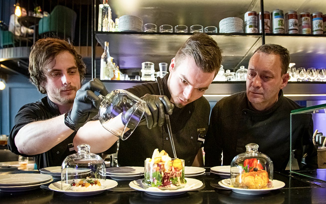Chef preparing Czech tapas dishes during a cuisine tasting tour.